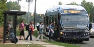 people boarding a public transportation bus