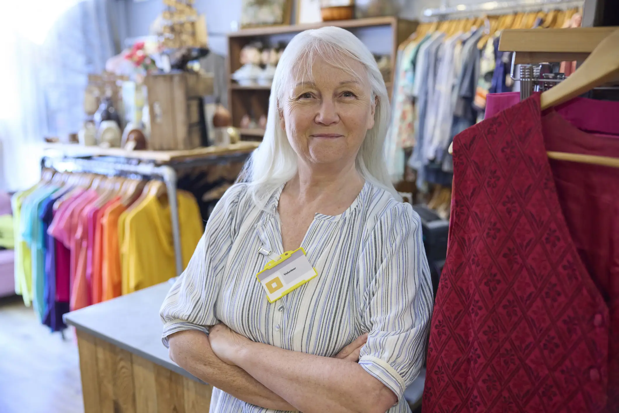 Senior woman working at a retail clothing store