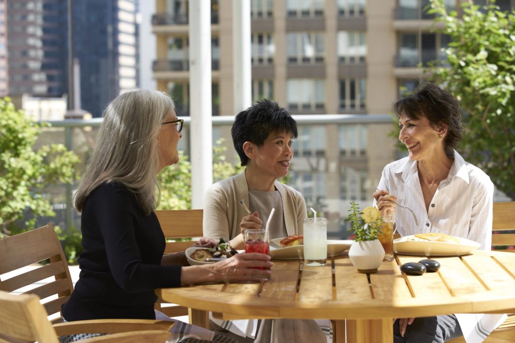 3 ladies sitting at table together