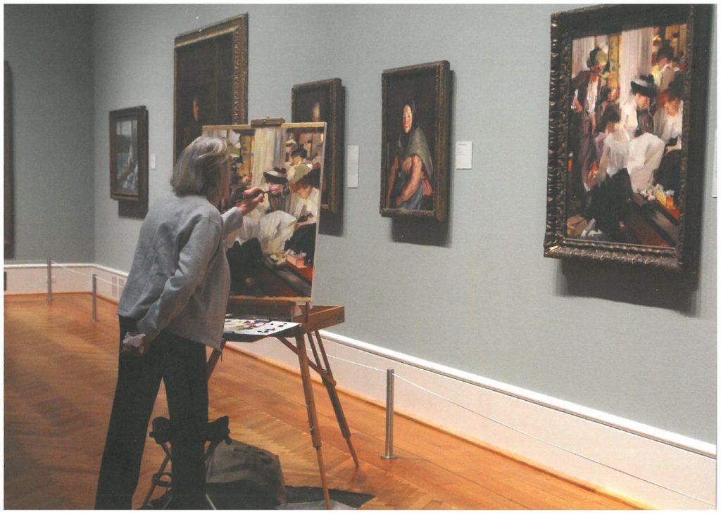 Art - Woman painting picture in gallery