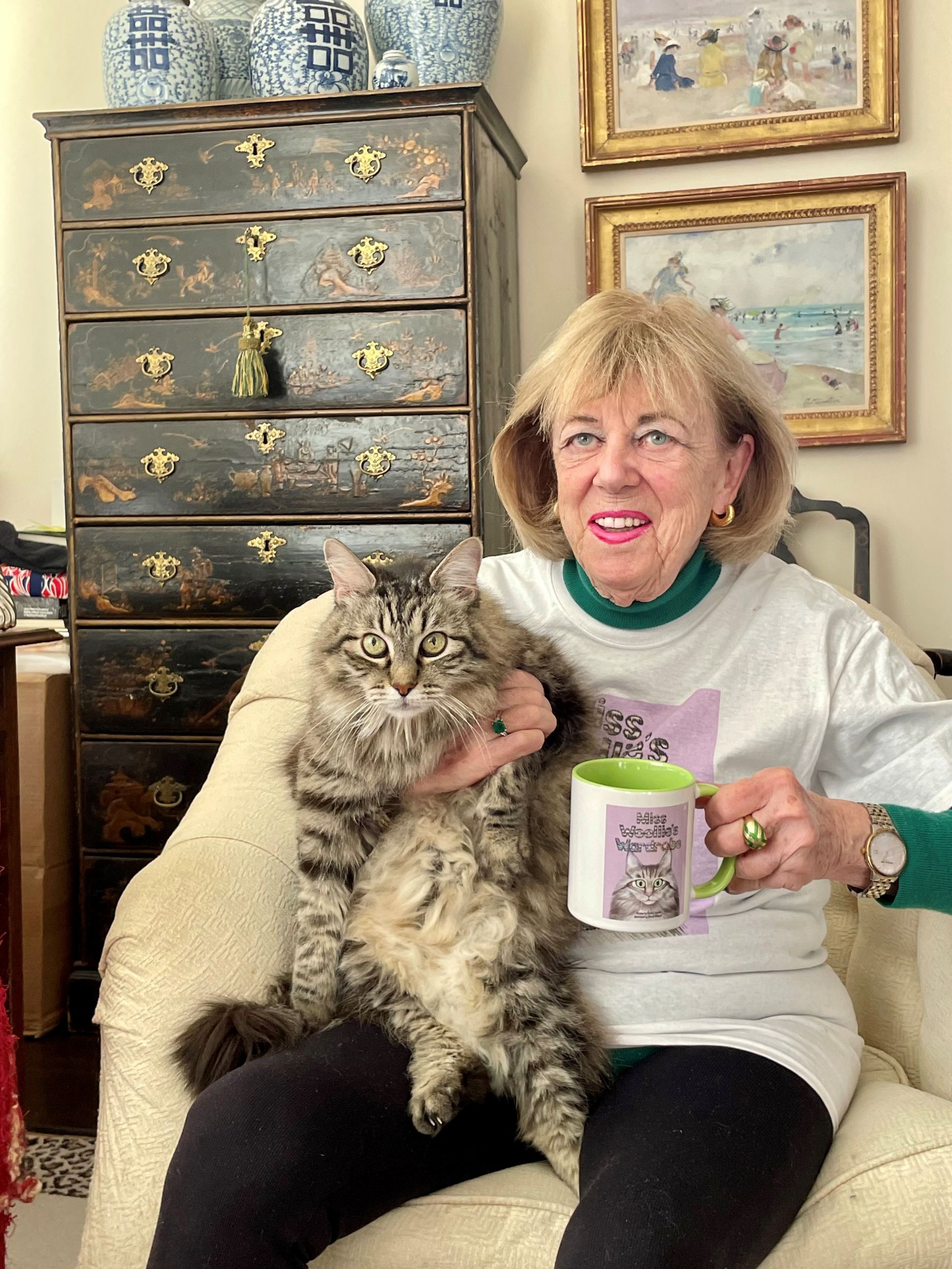 Miss Woolie Cat on lap of resident