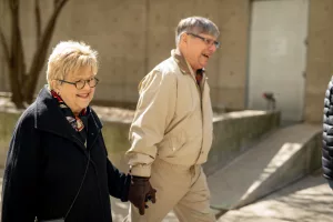 Couple walking outside, holding hands