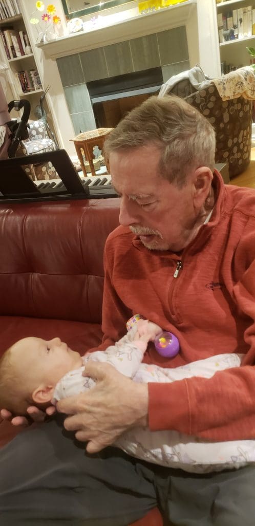 Larry holding baby