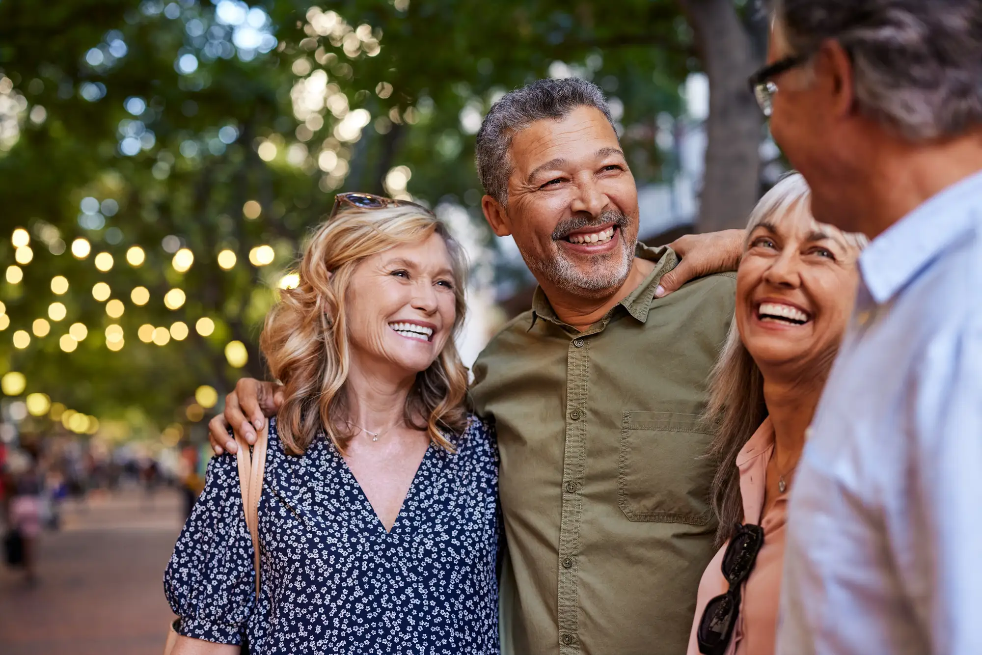 senior-independent-living-explained-blog-1 Senior couples arm in arm outside after learning about senior independent living explained.