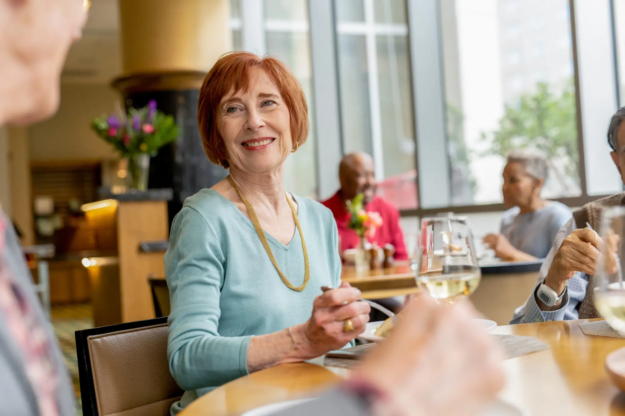 healthy-meals-for seniors-blog-1 An elderly woman at The Clare, exploring heart healthy meals for seniors as a part of their new innovative cuisine.